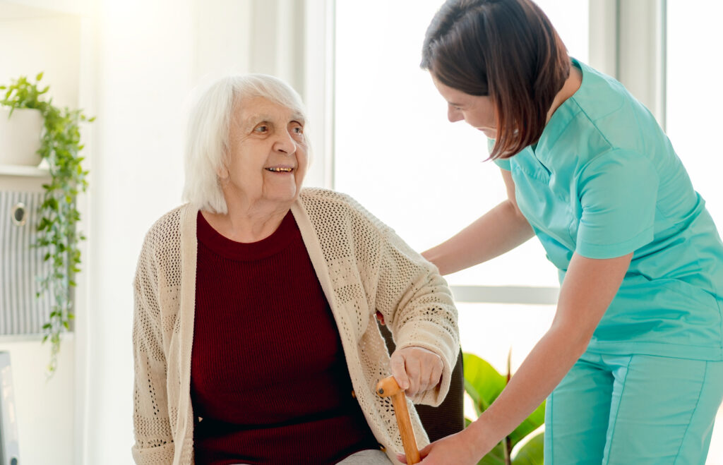 smiling senior woman with caregiver at home 2026 03 25 02 49 50 utc