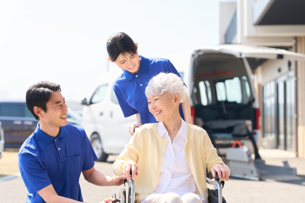 two caregivers assisting a senior woman in a wheel 2026 07 02 21 39 05 utc